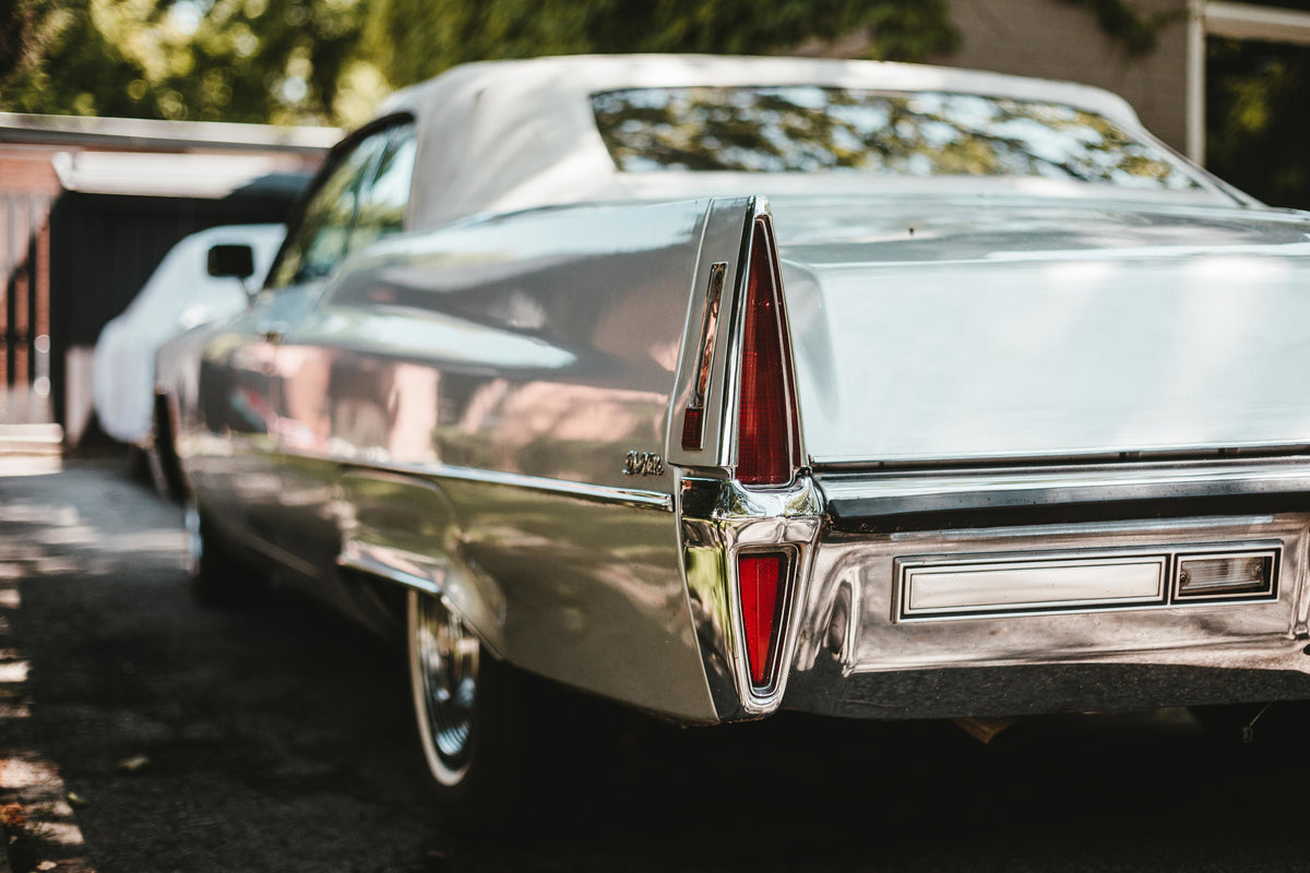 Back trunk view of a Silver 1950s Fleetwood Cadillac 